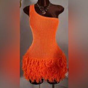 orange one-shoulder knit dress with a fringe hem